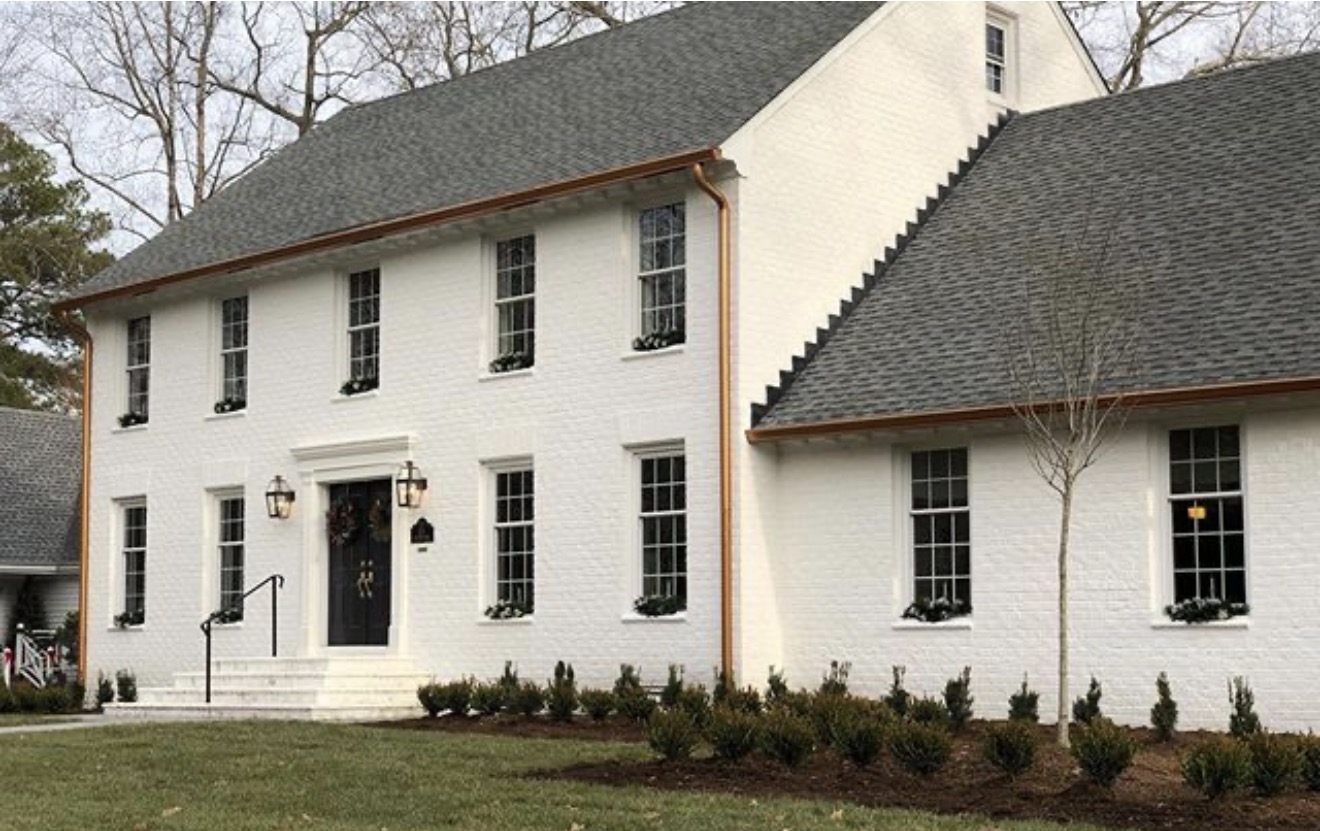 Elegant white house with landscaped yard